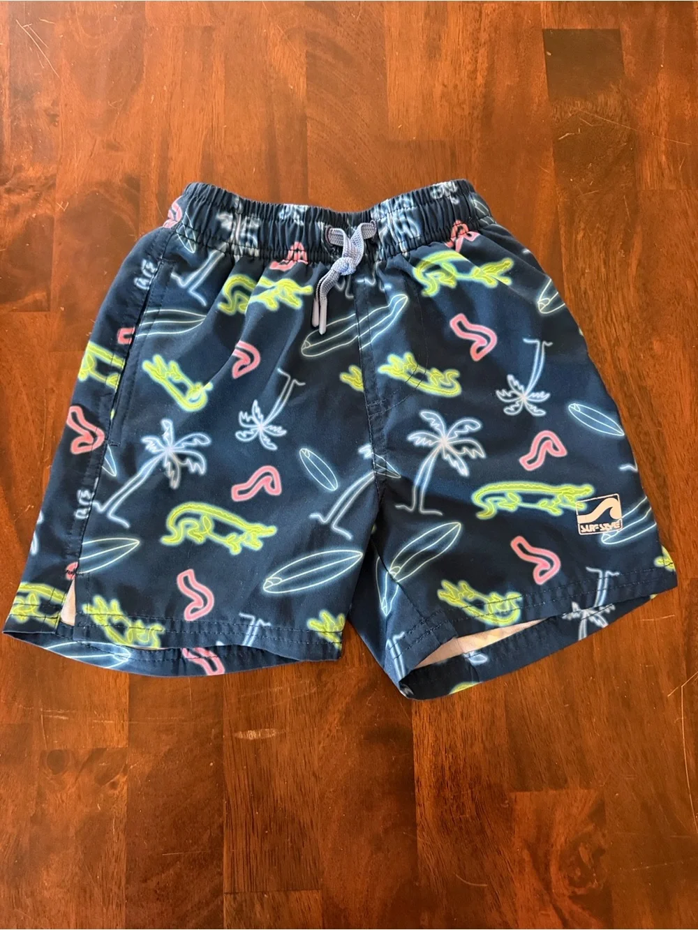 surf style Navy Swim Trunks with Neon Green, Pink and White Surf Prints